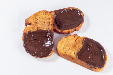 Fried bread with milk, egg, sugar, cinnamon and chocolate (Torrijas). Typical Spanish Easter sweet. Horizontal photography and selective focus