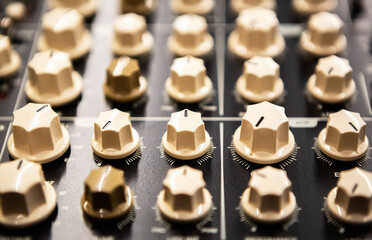 Analog equalizer panel on sound mixer. Mix musical tracks and record new music with professional...