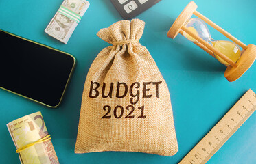 Money bag with the word Budget 2021. Budgeting, forecasting income and optimizing expenses. Planning expenditure for new financial year. Saving, economy, risk assessment. Accounting audit