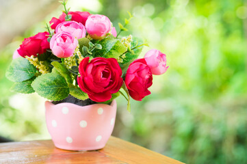 Artificial rose flowers in vase.