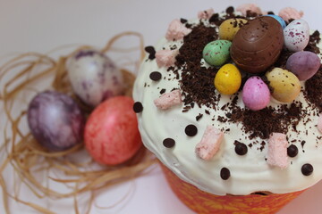 Happy easter cake with eggs. Chocolate kulich with decoration.