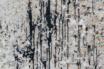 Obraz premium Concrete surface for the backdrop. Black smudges and streaks of dried paint.