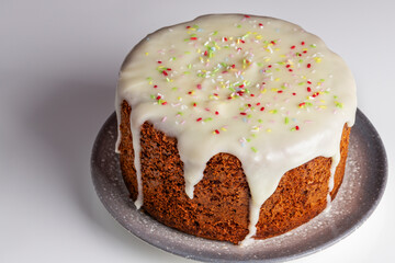 carrot cake tart with cheese cream topping on white background. horizontal shot