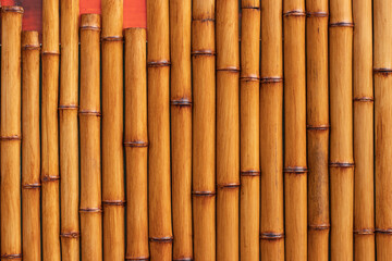 Fototapeta premium bamboo wall,plaster imitation of bamboo trunks.