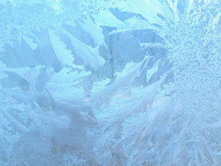 Frosty patterns on windows in winter.