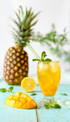 Iced tea with pineapple,  mango and fruits