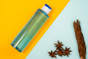 face tonic and natural elements in orange-blue background