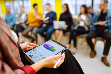 Graph, dynamics, sales statistics, financial chart, trading concept. Business group meeting seminar training concept. Planning, analysis, collaborate work in teamwork.