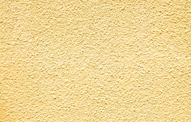 Yellow beton textured wall background and wallpaper copy space