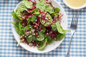 Bulgur, beetroot and spinach salad with vinaigrette sauce. 