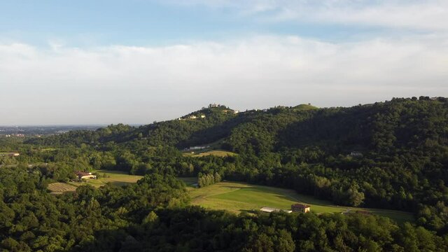 landscape with trees and clouds- village of Montevecchia and Curone Valley regional park, Brianza, Lombardy, Italy