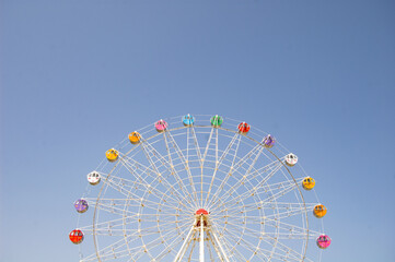 ferris wheel on a blue sky - Powered by Adobe