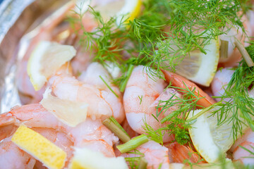 Peeled shrimps, lemon, dill, close-up. Recipe concept, cooking secrets.