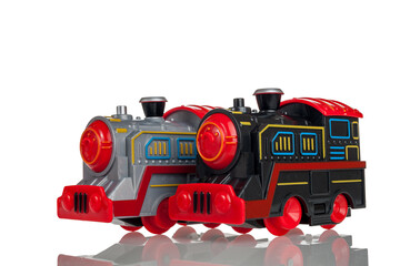 grey and black toy trains, locomotives isolated on a white background, close-up