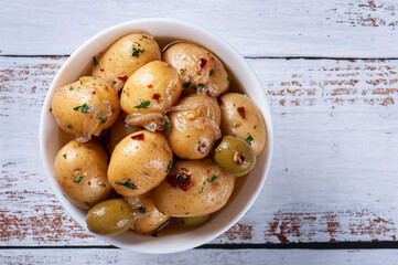 Homemade mini pickled potatoes in a white bowl
