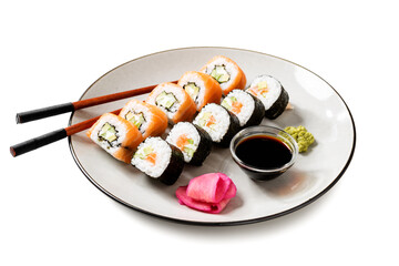 Traditional sushi  set - Philadelphia with salmon, cucumber avocado and cream cheese. Japanese cuisine. Isolated on white background.