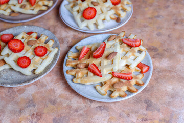 Homemade belgian waffles with strawberries.