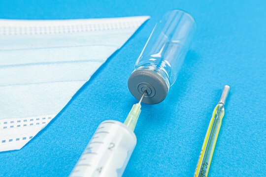 Blue background with surgical mask