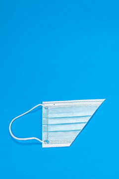 Blue background with surgical mask