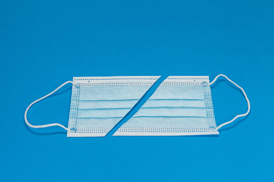 Blue background with surgical mask