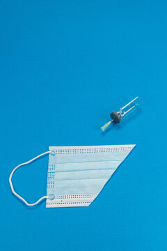 Blue background with surgical mask