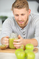 young man doing cook fresh vitamin juice