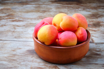 Heap of ripe juicy apricots on a table