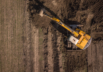 Excavator. Aerial top down drone shot.