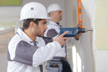 construction worker with drill perforator