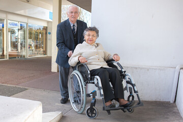 an elderly couple sat outside