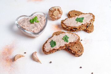 Fresh homemade chicken (duck,goose,rabbit,turkey) liver pate on whole grain bread with seeds.
