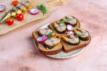 Slices of smoked fish mackerel or scomber.
