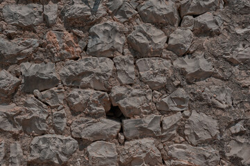 A wall of stones. an old house