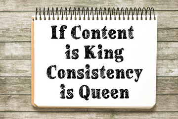If content is king, consistency is queen - blogging and social media tip - handwriting on a notebook