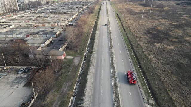 movement of a fire truck on the highway. aerial drone shooting