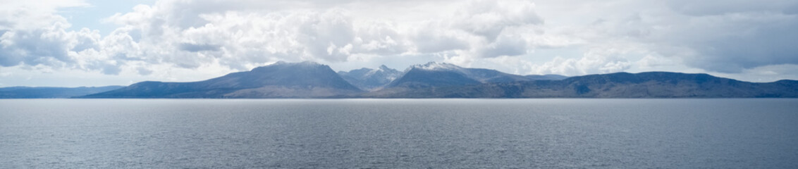 Arran viewed from Rothesay in Isle of Bute under dark clouds