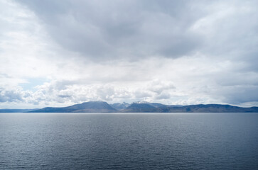 Arran viewed from Rothesay in Isle of Bute under dark clouds