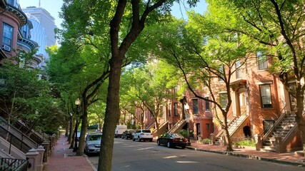 green street in a red city with buildings, card and a skyscraper in the distance (Holyoke street) © ZickZak
