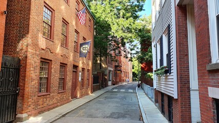 red street in the old town with Bruins and American flags