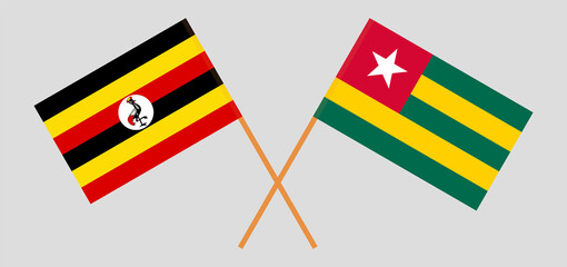 Crossed flags of Uganda and Togo. Official colors. Correct proportion