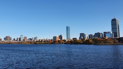 Fototapeta premium Boston city Skyline in autumn, skyscrapers and sea, clear sky