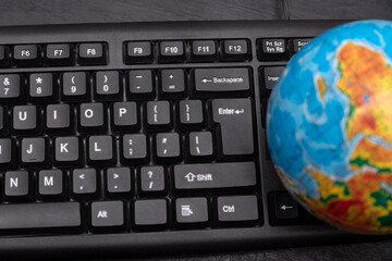 Globe on computer keyboard. Global computer business concept. World wide connection.