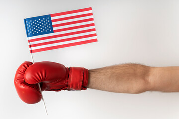 Boxing glove with USA flag. Boxer holds flag of United States. White background