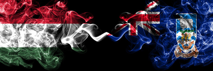 Hungary, Hungarian vs British, Britain, Falkland Islands smoky flags side by side.