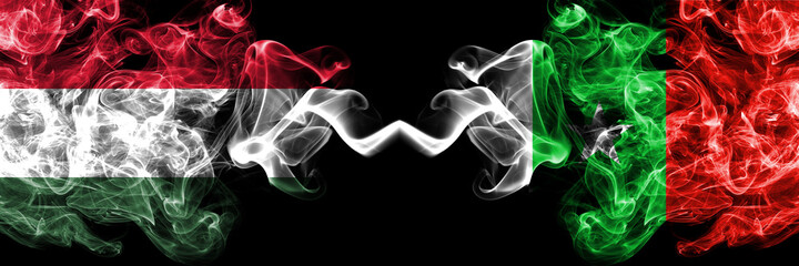Hungary, Hungarian vs Casamance, Senegal  smoky flags side by side.