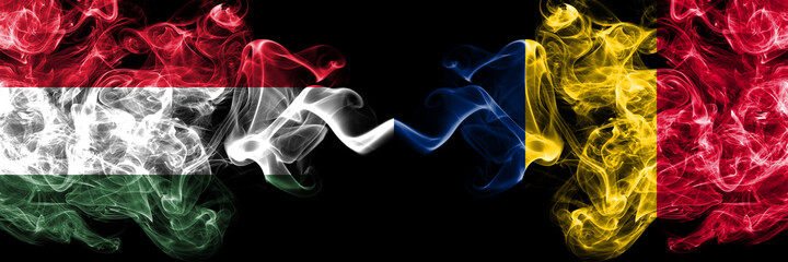 Hungary, Hungarian vs Chad, Chadian smoky flags side by side.