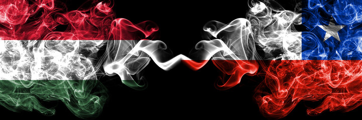 Hungary, Hungarian vs Chile, Chilean smoky flags side by side.