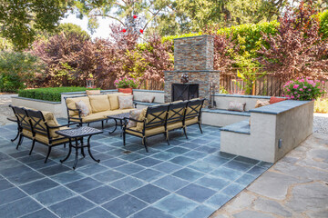 Inviting & Relaxing Outdoor Living Room and Entertainment Area with Settees, Cushions, Benches, Fireplace - obrazy, fototapety, plakaty
