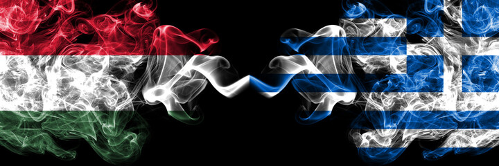 Hungary, Hungarian vs Greece, Greek smoky flags side by side.
