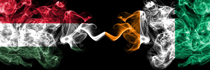 Hungary, Hungarian vs Ivory Coast smoky flags side by side.